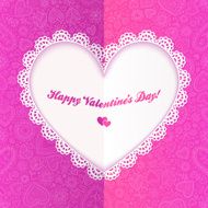 Cutout lacy paper heart on pink ornate background