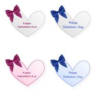 Heart-shaped cards tied bow