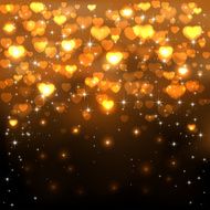 Golden hearts on dark background