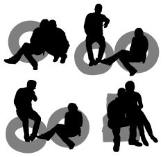 Silhouette of people with inner tubes