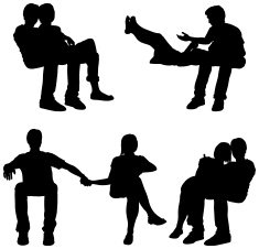 Sitting couples cuddling and holding hands