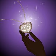 Silver necklace with diamond heart on the hand blue background