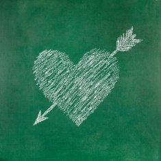 Heart shape with arrow on blackboard