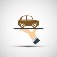 Hand holding a tray with car