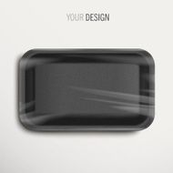 empty wrapped black food tray