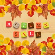 Autumn background with leaves and colorful letters