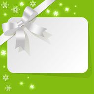 Gift Card with white ribbon on green background snowflakes