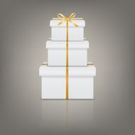 Stack of three realistic white gift boxes with golden ribbon