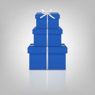 Stack of three realistic blue gift boxes with white ribbon