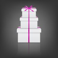 Stack of three realistic white gift boxes with pink ribbon