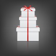 Stack of three realistic white gift boxes with red ribbon