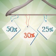 Sales tags with percents discount tied on the ribbon