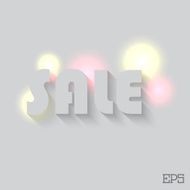 The inscription SALE on a grey background paper