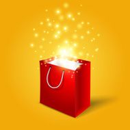 Red shopping bag with magic light fireworks from it