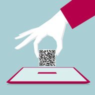 Hand holding QR Code into the Tablet PC