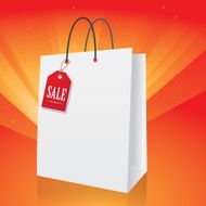 White shopping papar bag with sale tag on bright background