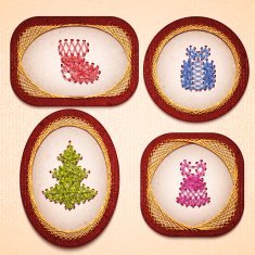 Vector badges with some Christmas elements embroidered on cardboard