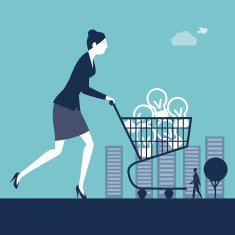 Businesswoman pushing a shopping cart with light bulbs