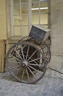 Old fire trolley in front of window