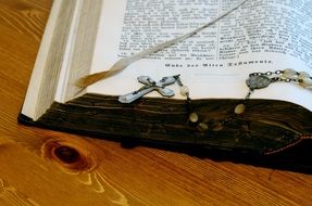 holy bible with a stone crucifix