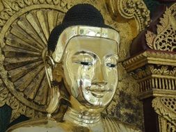 gold covered Buddha face