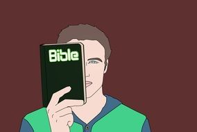 a young man reading a bible