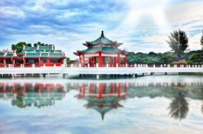 asian temple on a river bank