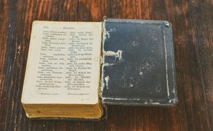 old prayer book on the wooden table