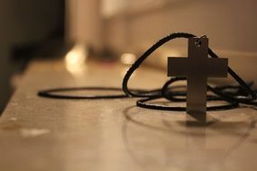 metal cross with rope