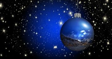 A bright blue Christmas picture inside the ball depicts the landscape