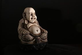 Buddha statue on a black background in China