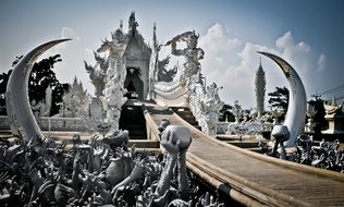 Grand entrance to the white temple in Thailand