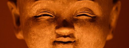face of smiling Buddha