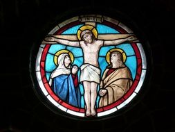 stained glass window of the crucifixion of Jesus