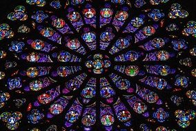 colorful stained glass window in Notre Dame Cathedral