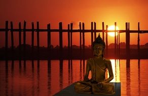 Buddha statue in sunset meditation