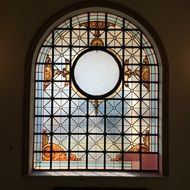 stained glass window with a hole in the church