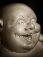 smiling buddha sculpture