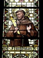 Stained-glass window with the image of a monk