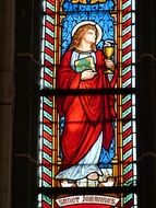 stained glass window with the image of St. John