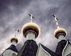 golden domes on the grey sky background