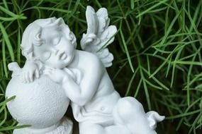 statue of sleeping angel dormant rest christian religion