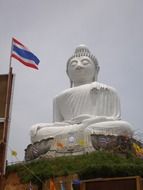 white buddha statue near wall in thailand