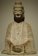 stone figure in a pose of meditation