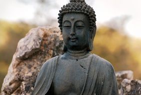 stone meditating Buddha