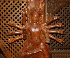 Wooden statue of goddess in buddhism religion