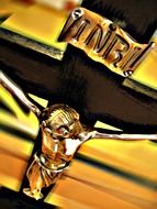 golden cross with the inscription closeup
