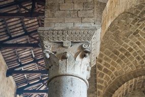 decorated capital of a pillar in benedictine monastery