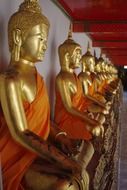 golden sculptures in a buddhist temple