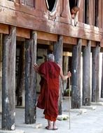 monk near the wooden buddhist temple